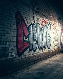 Explore stunning street art with this cinematic image showcasing vibrant graffiti splashes on a textured brick wall. This cap