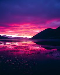 A wet rainy scene captures the reflection of a sunset in a glassy fjord. The artwork is characterized by drizzling rain, whic