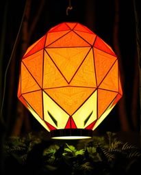 Discover the enchanting beauty of a bioluminescent origami lantern glowing in a dark forest. This intricate artwork showcases