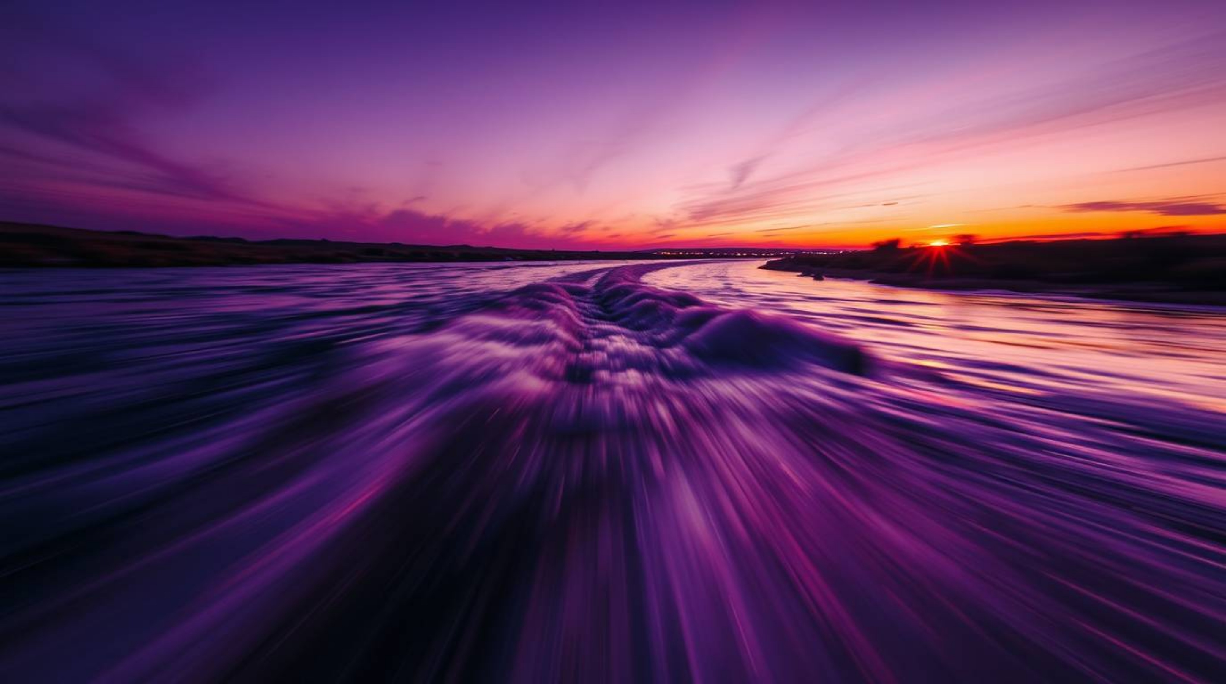 Experience the beauty of a river delta as it glows in twilight colors, bathed in the warm golden hour light. This dynamic ima