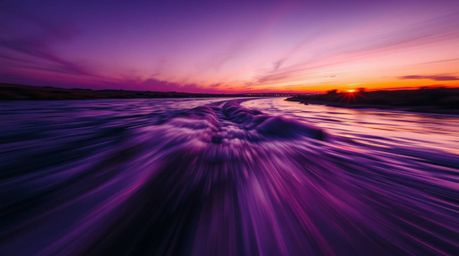 Experience the beauty of a river delta as it glows in twilight colors, bathed in the warm golden hour light. This dynamic ima