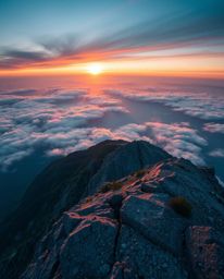 This artwork depicts a sunset from a high alpine peak, captured from a high-angle perspective that creates a truly dreamlike 