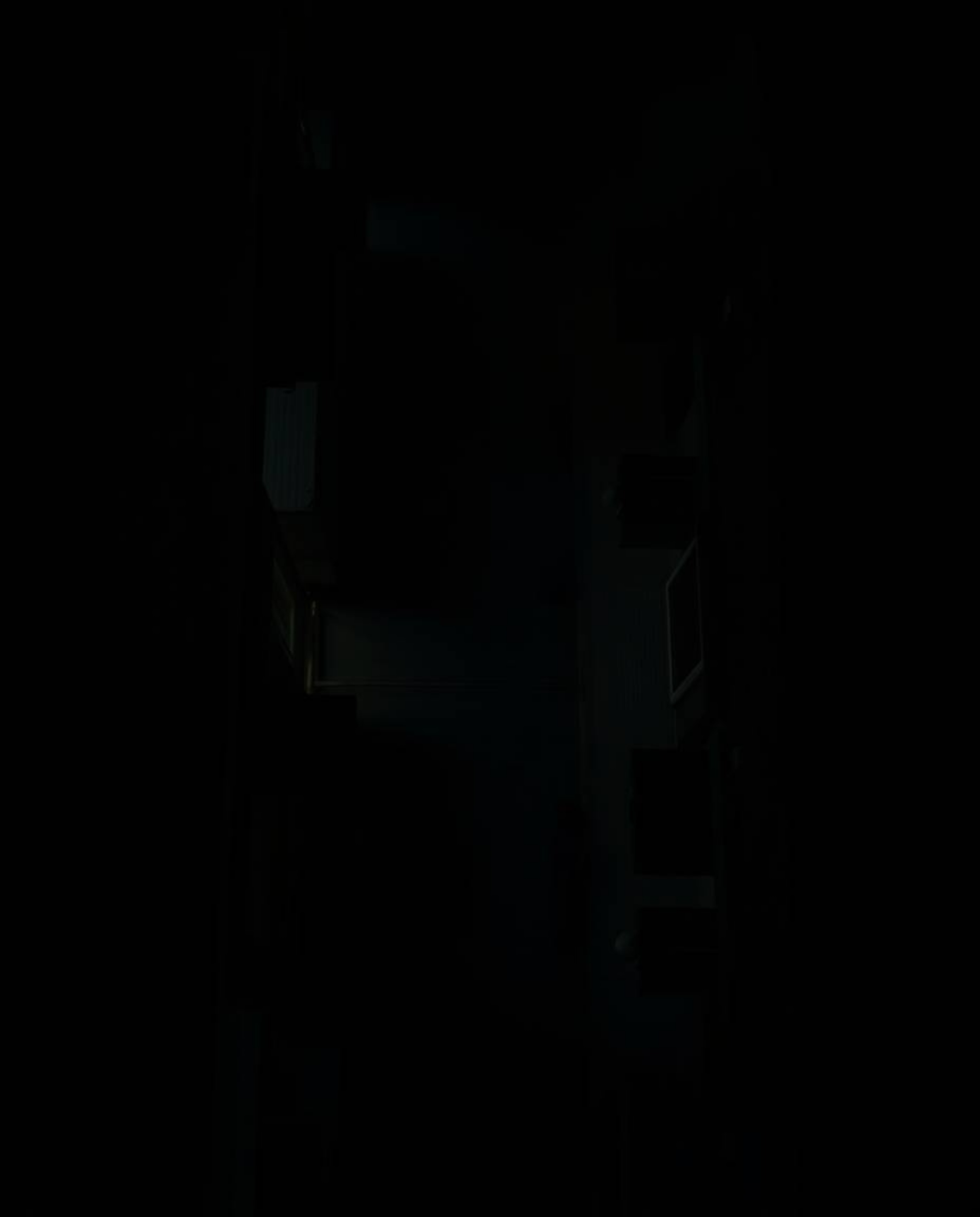 Capture the dramatic tension of a bird's-eye view overlooking a shadowy night alley, highlighted by high contrast and low-key
