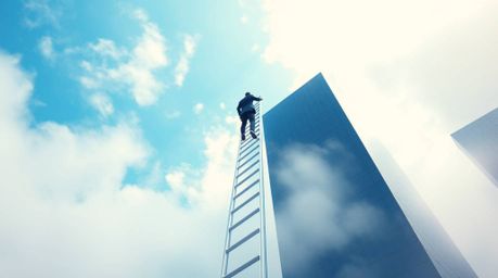 An ambitious businessperson ascends a transparent ladder disappearing into a vibrant blue sky above towering skyscrapers, shr