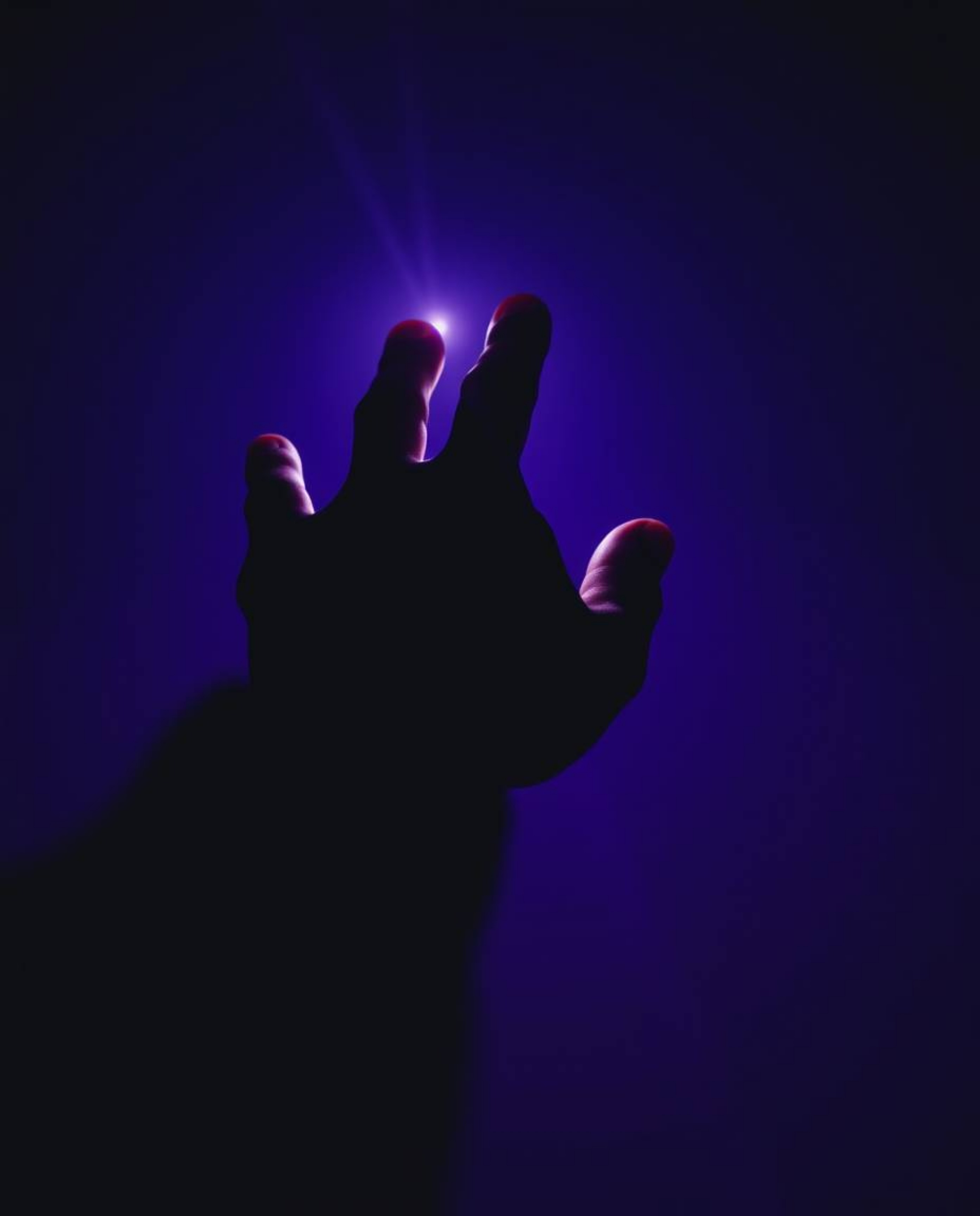 A captivating image depicting a hand reaching towards light from the depths of darkness, rendered in deep ultraviolet hues an