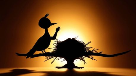 A captivating low-angle silhouette photograph showcases two cartoon birds diligently building a nest in a classic animation s