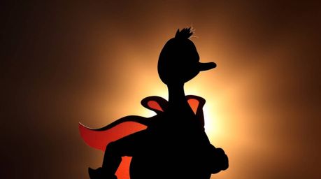 A charming digital painting featuring a silhouetted duck donned in a zany superhero costume. The backlighting enhances the ad