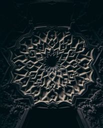 Explore the beauty of Islamic geometric stone carvings, captured in an overhead view with intricate details and historical ac