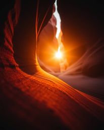 This creative light art piece offers a detailed close-up shot of sandstone cliffs in a canyon, illuminated by the warm glow o