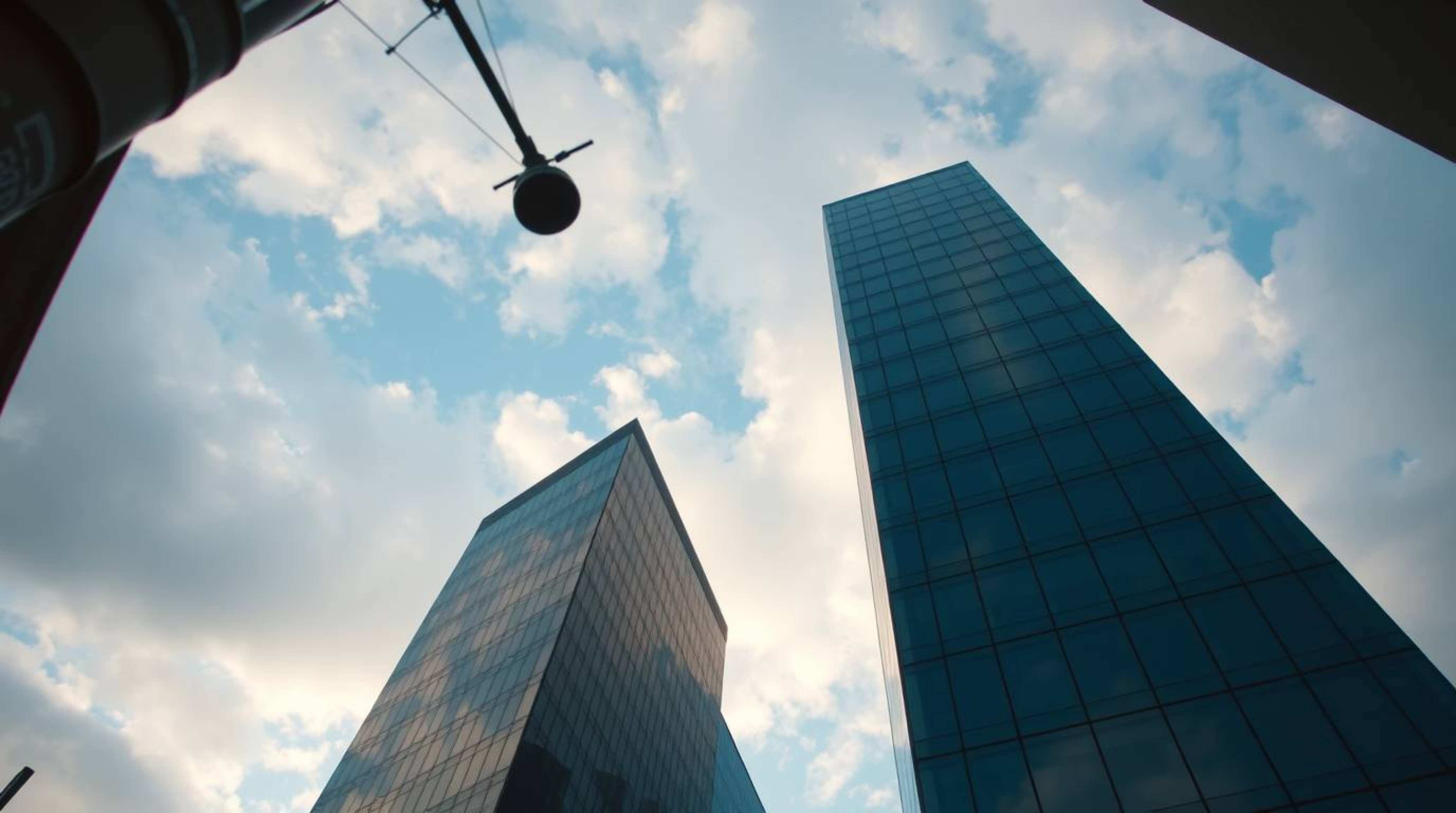 A captivating street photograph taken from a low angle presents a modern glass building seemingly dissolving into a soft, clo