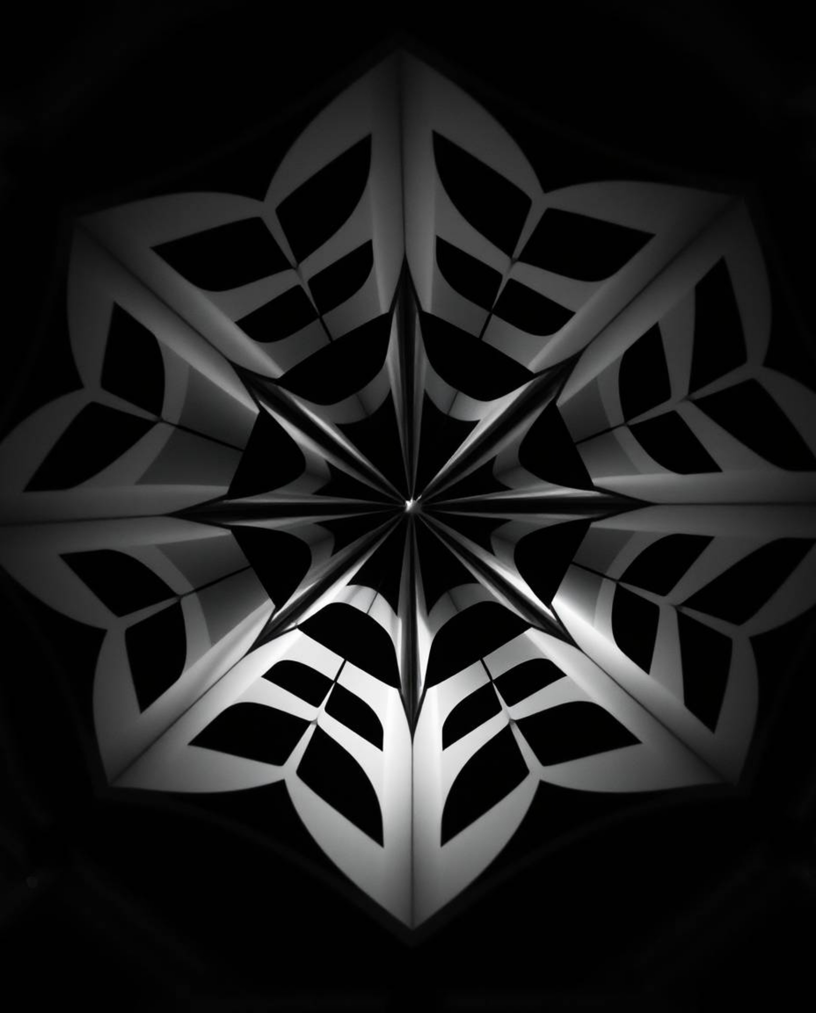 Explore the mesmerizing high-angle perspective of a black and white geometric pattern designed in an optical illusion style. 