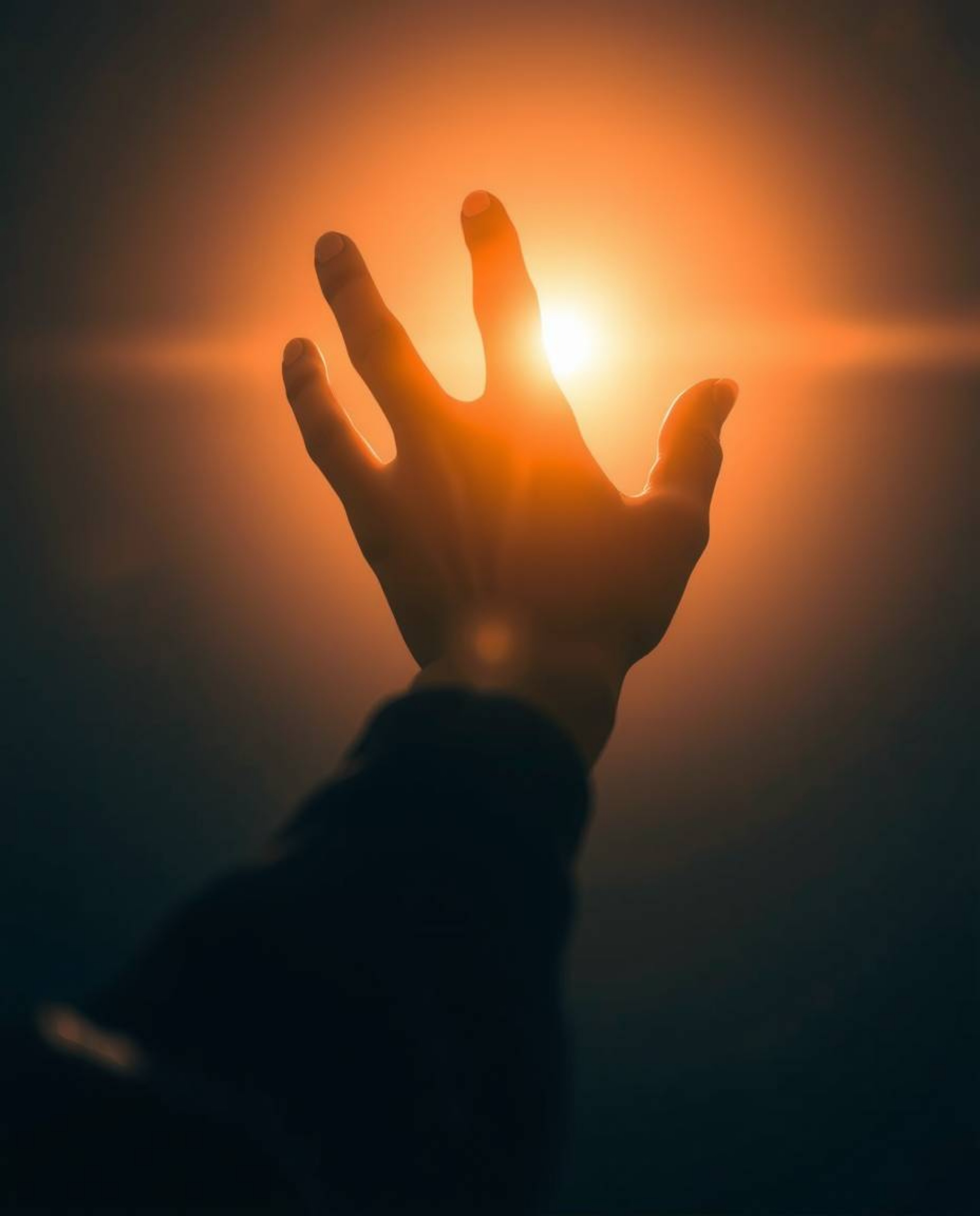 A compelling image featuring a silhouetted hand extending towards a source of light from the darkness, infused with futuristi