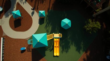 Experience a dramatic slow-motion run through a playground from a unique overhead perspective. This captivating video emphasi