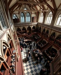 Capture the enchanting essence of a magical school through a precise architectural color photograph. This high-angle perspect