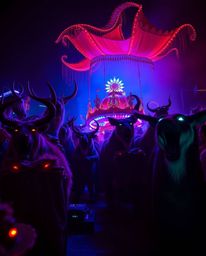 Imagine a carnival, once a place of joy and laughter, now dramatically overtaken by wild animals. This scene is rendered in a