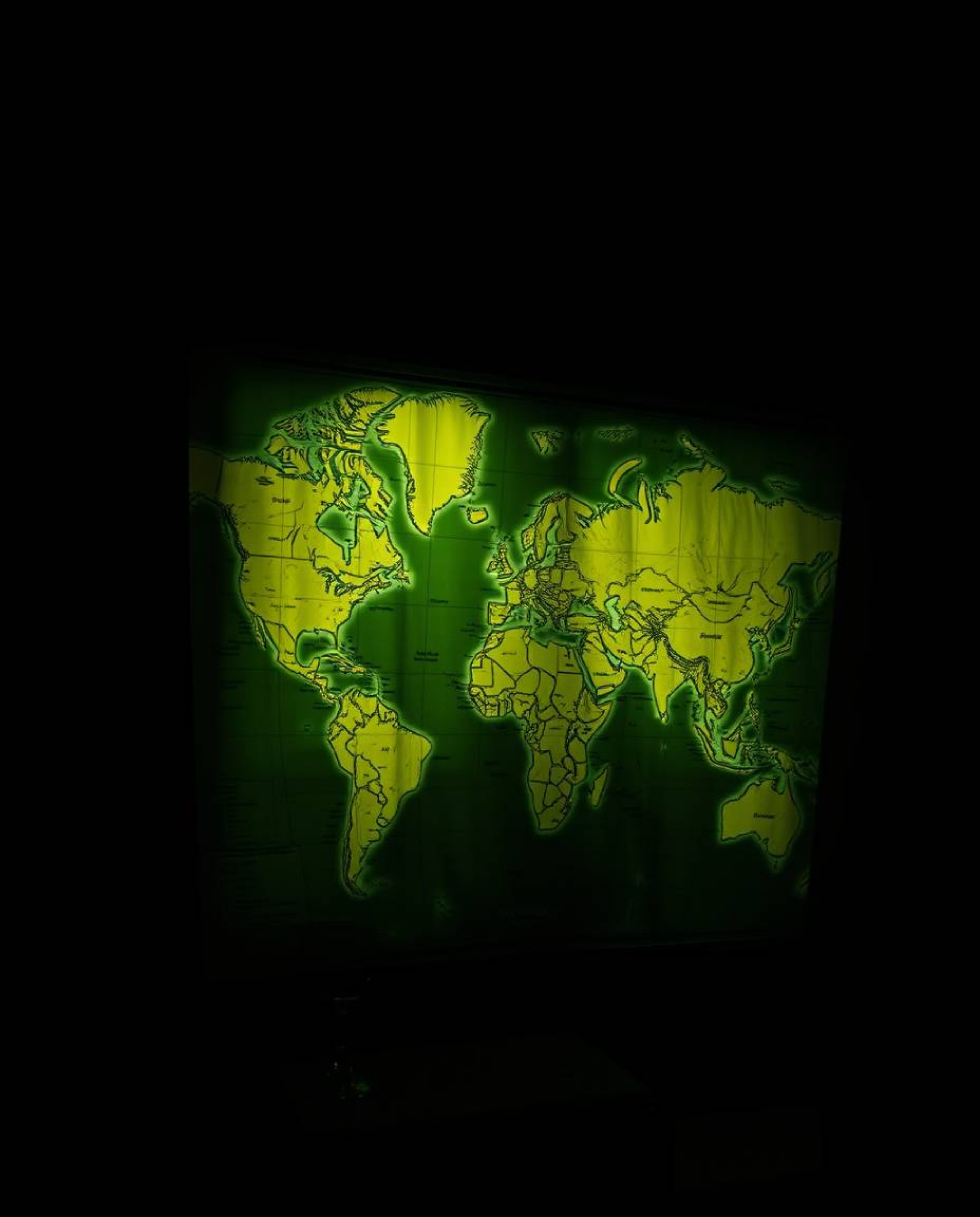 This image features a captivating close-up shot of a glowing map projected in an old study, dramatically illuminated with chi