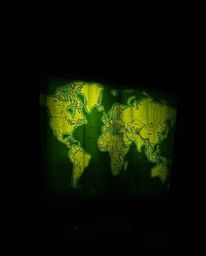 This image features a captivating close-up shot of a glowing map projected in an old study, dramatically illuminated with chi