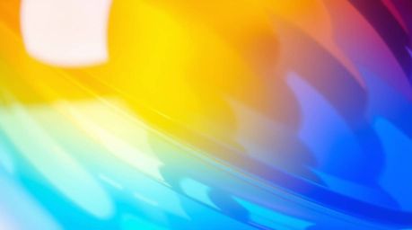 A captivating close-up photograph showcasing a glass object masterfully reflecting smooth gradient textures. The image featur
