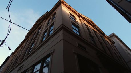 Experience the thrill of an architectural chase scene captured in a stunning, low-angle photograph. This image showcases exag