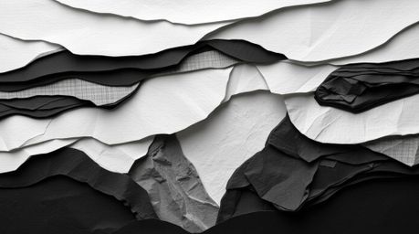 Explore the timeless elegance of layered papier-mâché in classic black and white, juxtaposed against the warm sunset hues of 