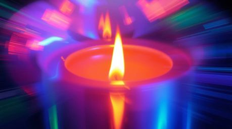 Experience the mesmerizing effect of dynamic motion blur on an iridescent metallic surface, reflecting warm candlelight.  Vib
