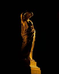 Explore a mesmerizing blend of classical artistry and digital disruption. These images showcase classical sculptures bathed i