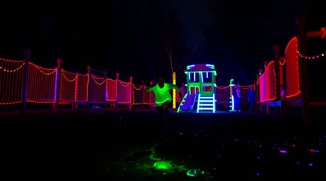 Experience a dramatic slow-motion run through a playground bathed in bioluminescent colors and natural light effects. This vi