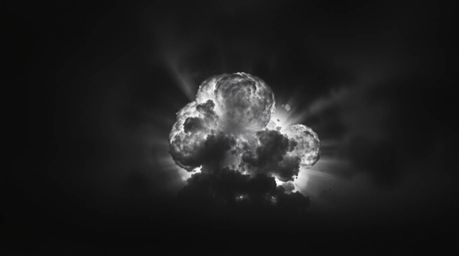 A classic black and white image depicting a dramatic TNT explosion in the Wild West. The dark tones and unsettling details cr