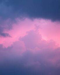 A captivating weather scene showcases intense contrasts in color and balanced tones, highlighted by a soft gradient of pink, 
