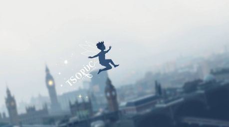 This geometric logo features a young boy soaring above the London skyline, propelled by softly glowing pixie dust. The desig