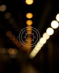 Explore the captivating interplay of blurred bokeh and dramatic lighting, accentuating a minimalist geometric pattern of circ