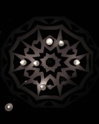 Experience the allure of a top-down black and white image showcasing warm candlelight illuminating a geometric optical illusi