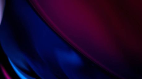 A close-up detail showcasing a glass object exquisitely reflecting smooth gradient textures in rich burgundy and deep blue hu