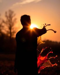 Explore captivating visuals featuring a silhouetted figure bathed in the warm glow of an autumn sunset, backlighting creating