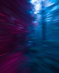 This creative light art piece captures dynamic motion with rich burgundy and deep blue hues. A digital glitch effect is layer
