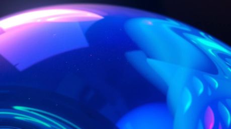 Explore a stunning close-up image showcasing a glass object reflecting smooth gradient textures.  The scene is bathed in glow