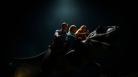 A captivating low-angle perspective showcases a prehistoric family embarking on a thrilling adventure in their dinosaur car. 