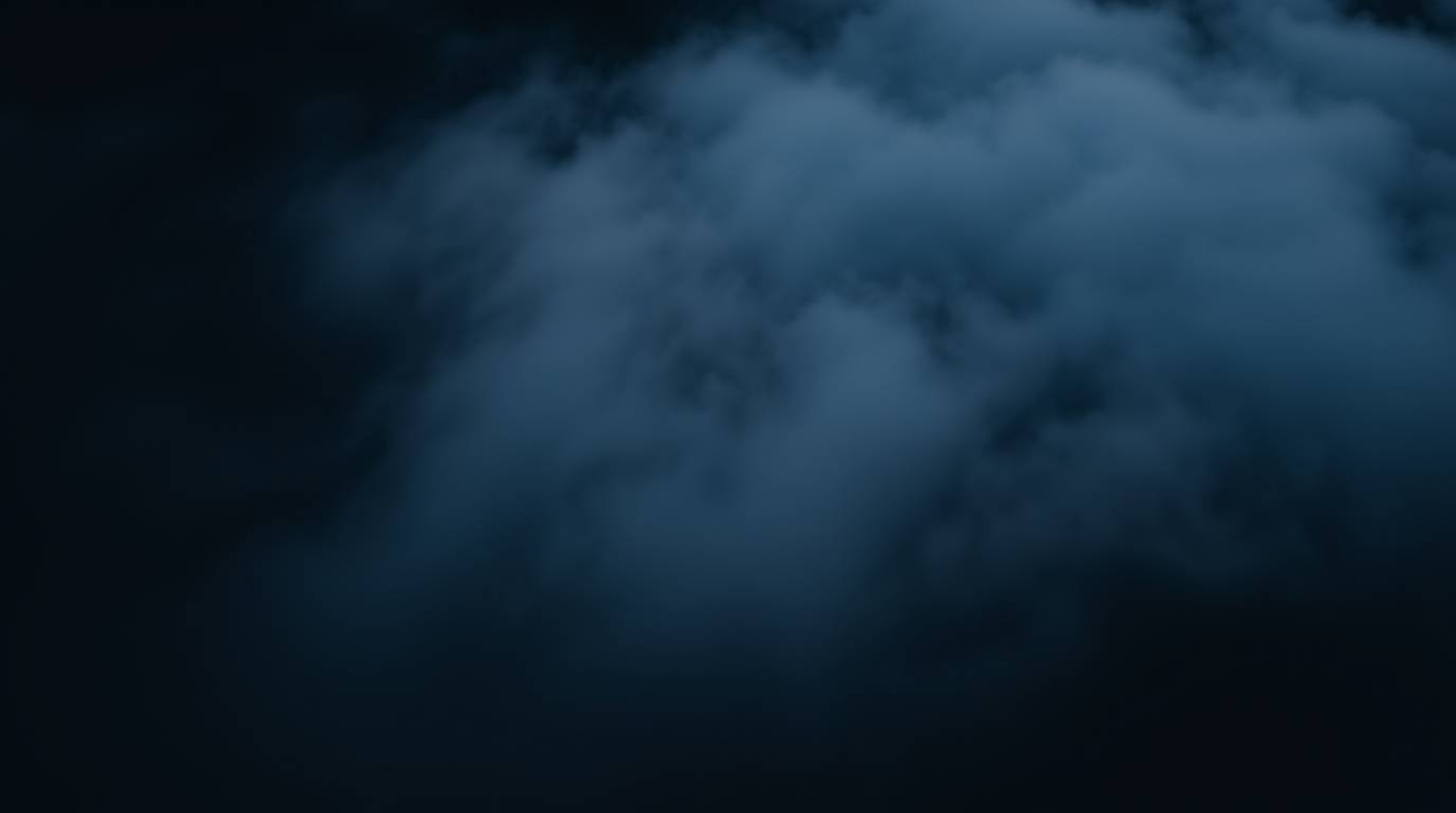A captivating overhead birds-eye view reveals intense jet black contrasts against a breathtaking sunset. Fog-covered hills ar