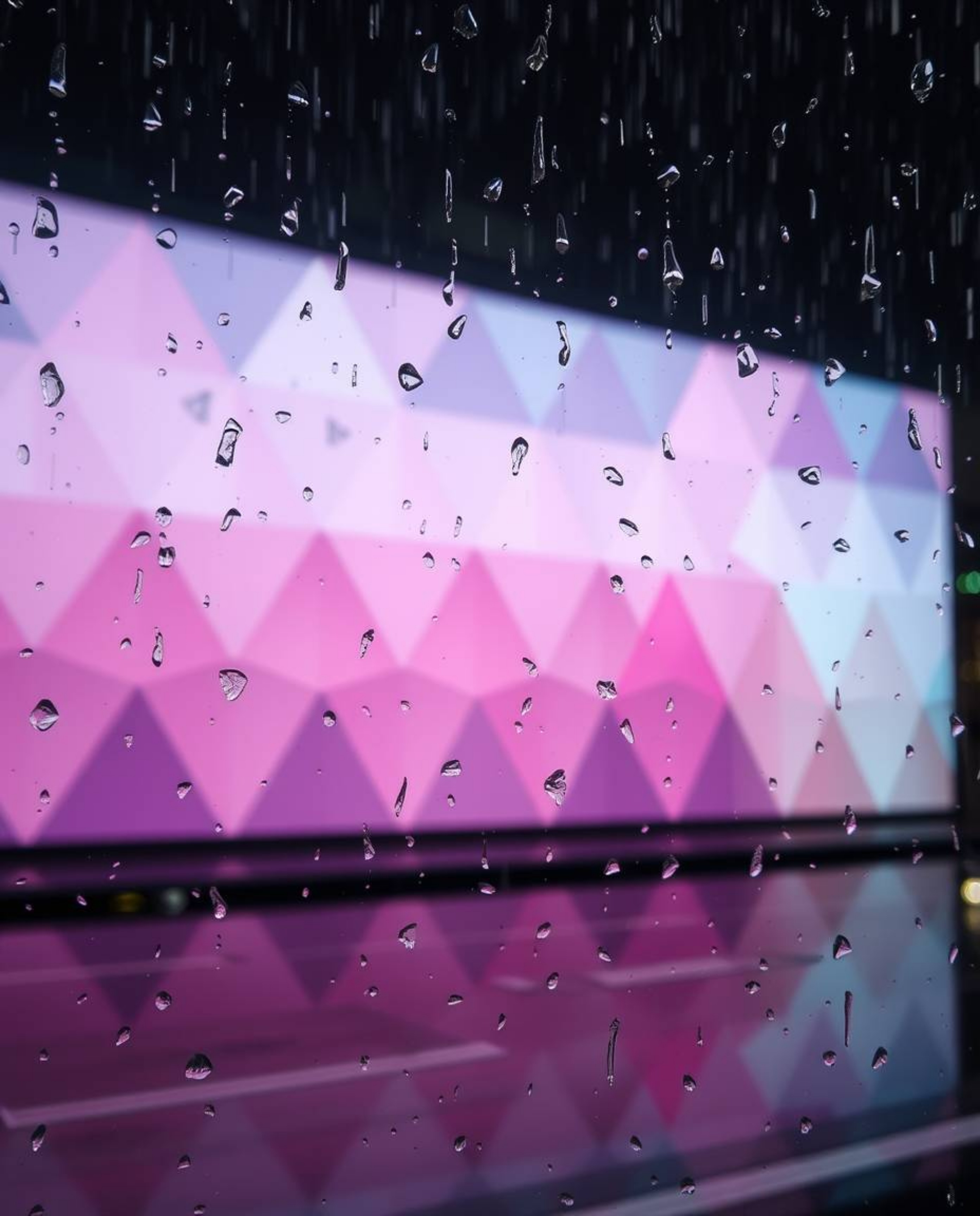 A captivating image showcasing a wet, rainy scene featuring a geometric pattern wallpaper with pastel gradients.  The soft, m