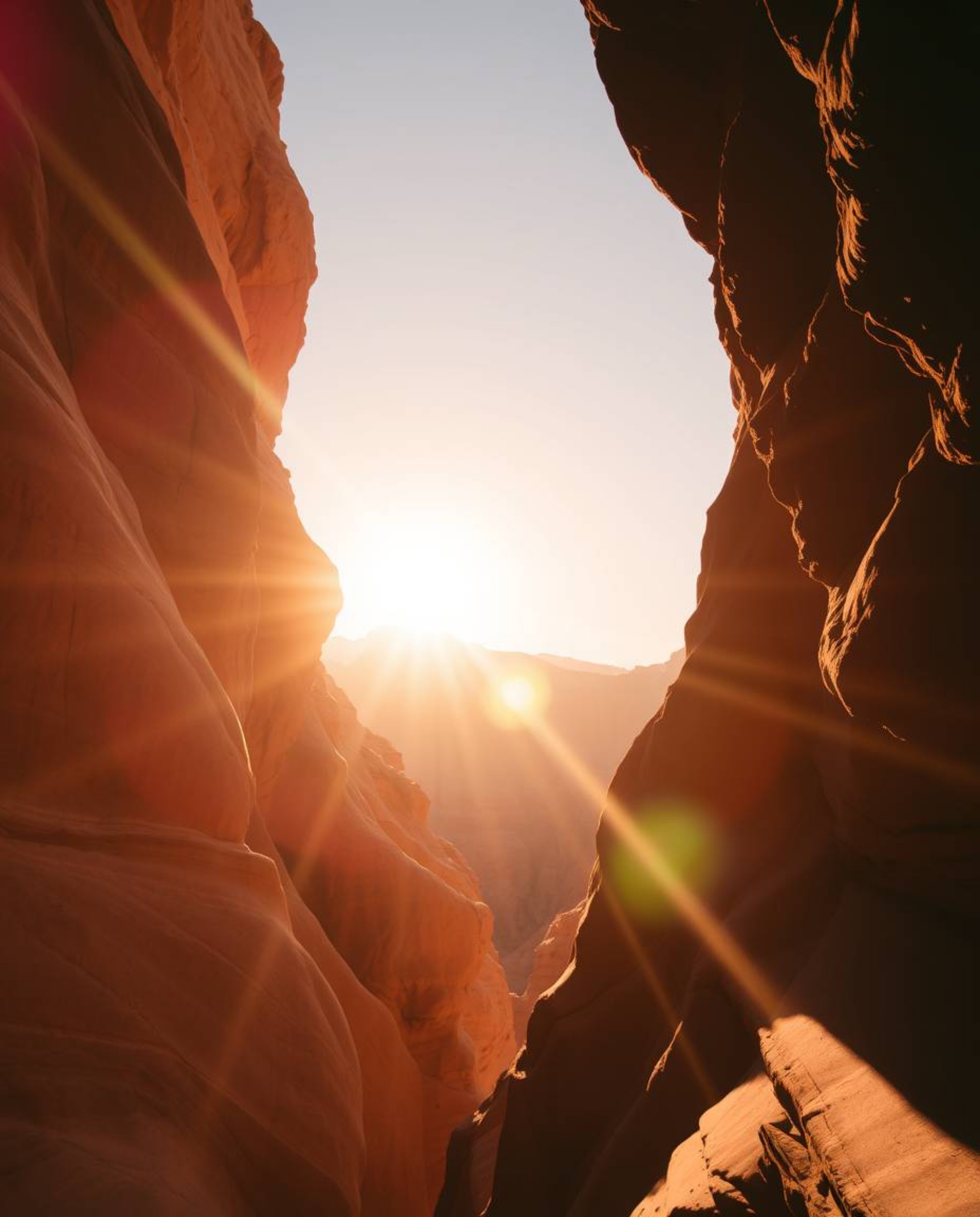 A vibrant depiction of a sunset illuminates sandstone cliffs in a canyon, characterized by bright lens flares and dynamic lig