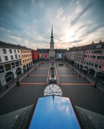 Experience the tranquility of an empty town square captured from a high-angle perspective. Iridescent colors create mesmerizi