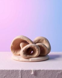This sculptural clay art piece features beautifully modeled shapes and a richly textured surface. A soft gradient texture ble