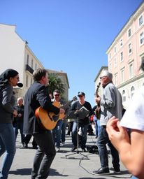 Experience the energy of a vibrant town square come to life through candid street photography. This image captures a spontane