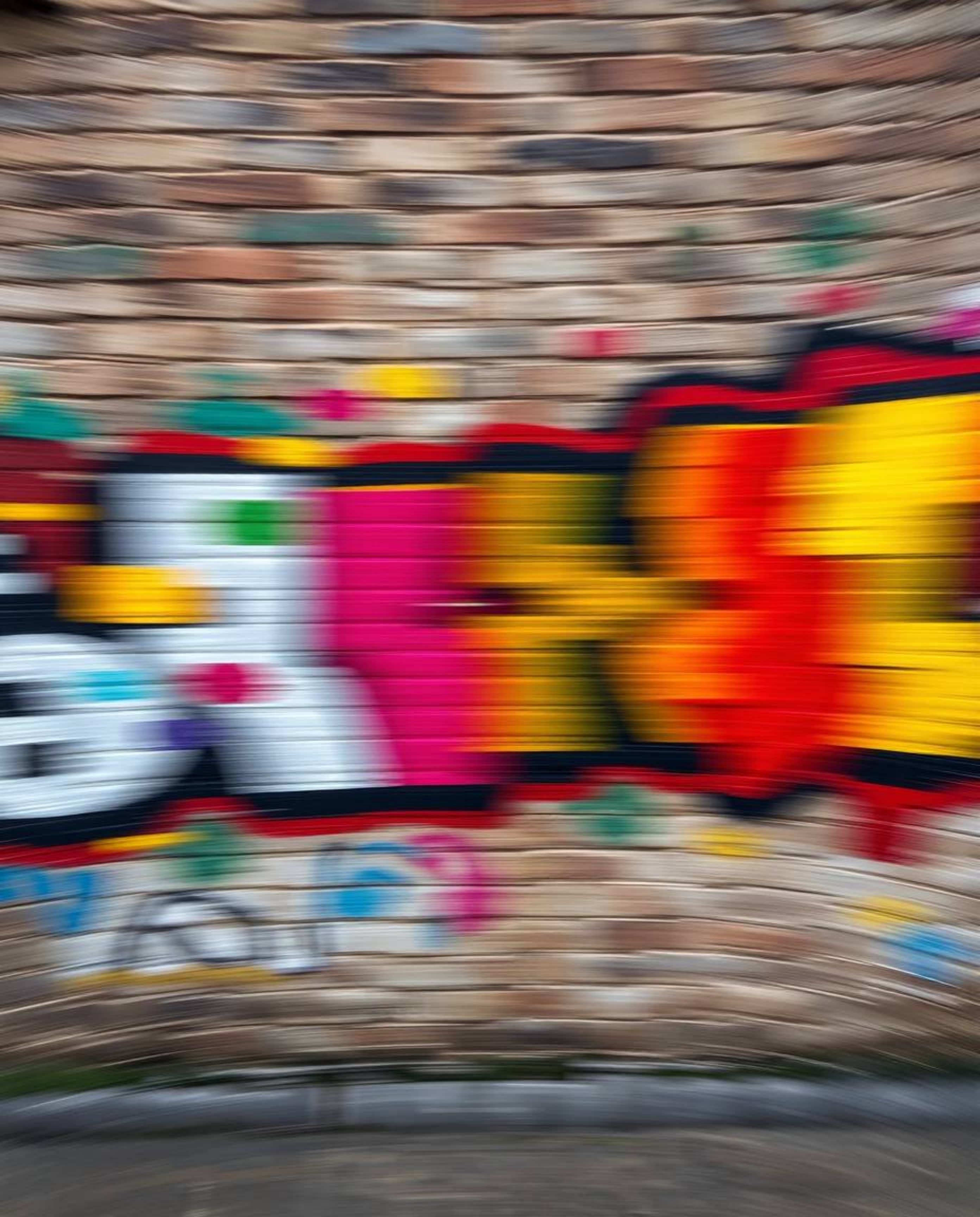 Capture the essence of urban art with this high-resolution stock photo featuring dynamic motion blur and vibrant graffiti spl