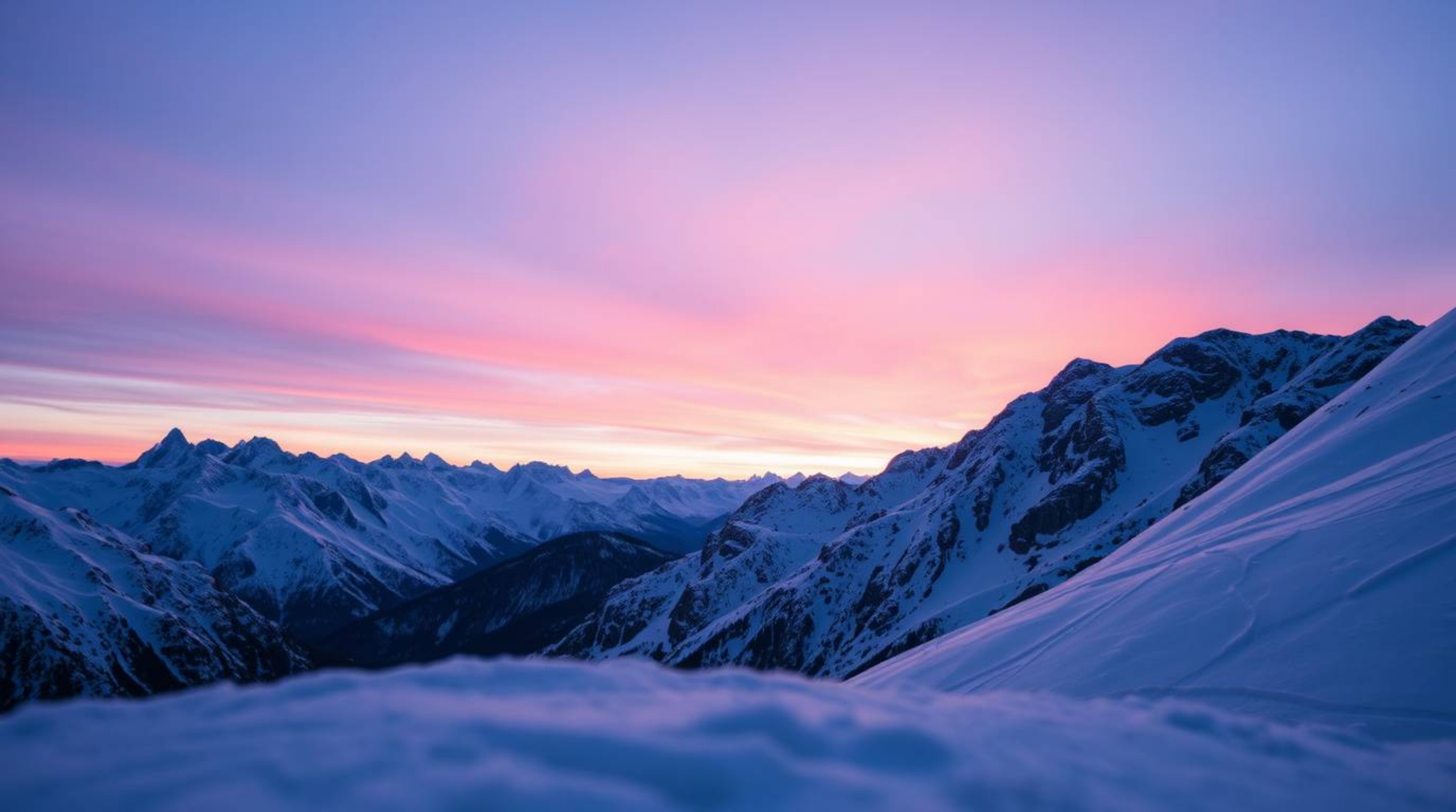 A breathtaking close-up captures snow-covered mountains illuminated by a soft, pastel sunset. Detailed textures are brought t