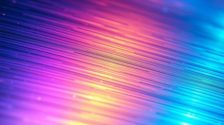Explore the captivating beauty of an iridescent gradient texture on a metallic surface, captured in extreme macro close-up. T