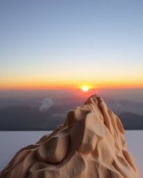 Experience a unique interpretation of a sunset from a high alpine peak with this soft and dreamy sculptural clay art piece. T