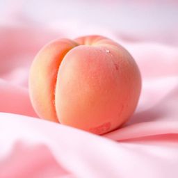 A bold acrylic painting featuring a close-up ASMR aesthetic of a soft blushing pink peach resting on silky pastel pink fabric