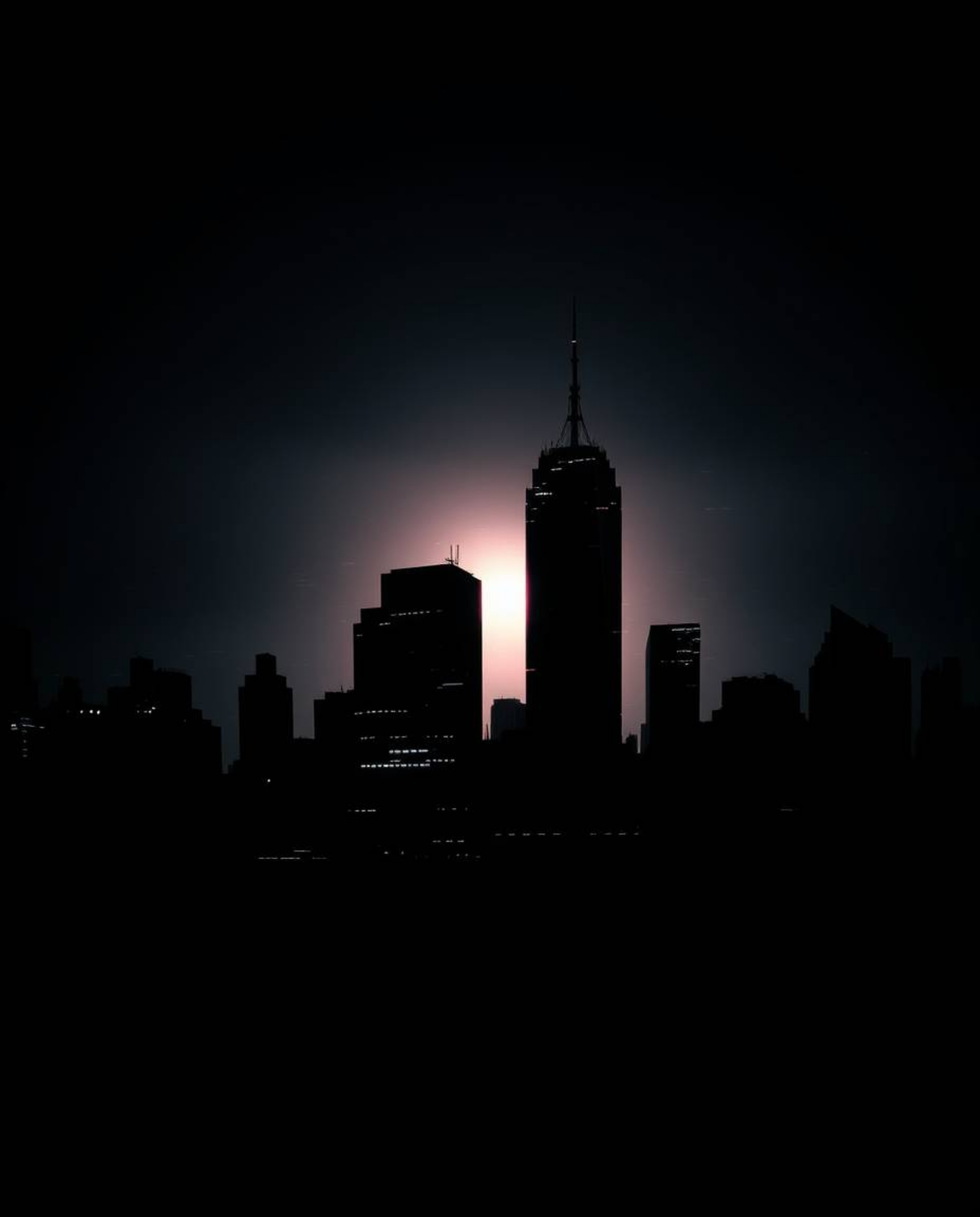 A striking, moody image showcases a silhouetted glitchy digital landscape. Distorted skyscrapers pierce a sky filled with sta