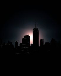 A striking, moody image showcases a silhouetted glitchy digital landscape. Distorted skyscrapers pierce a sky filled with sta